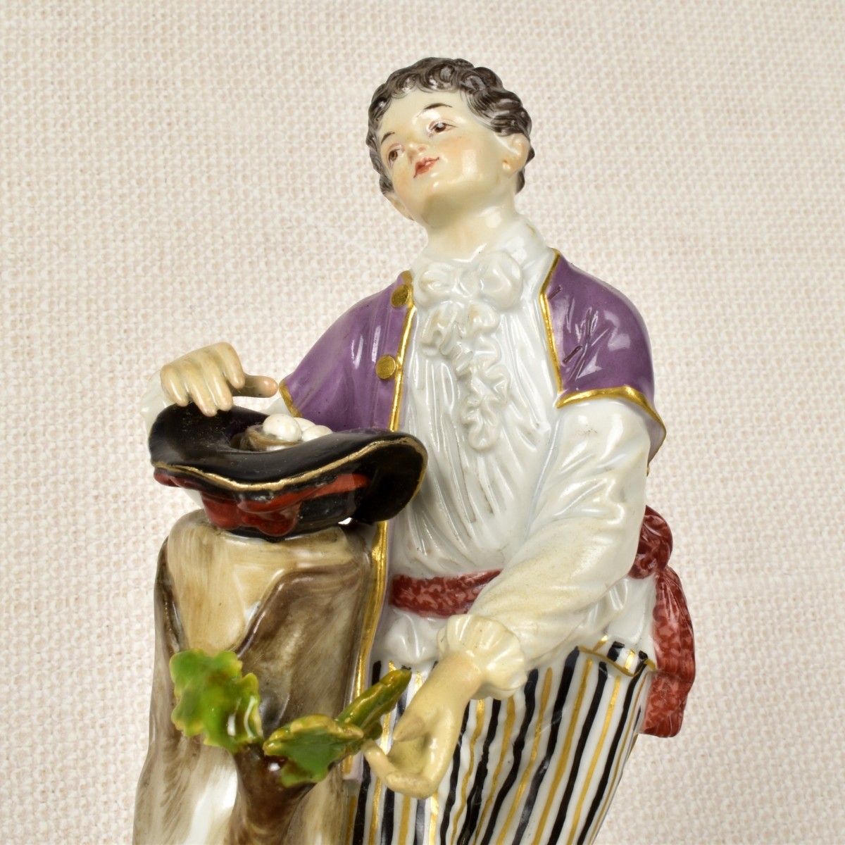 Meissen Figurine of a Boy Gathering Eggs