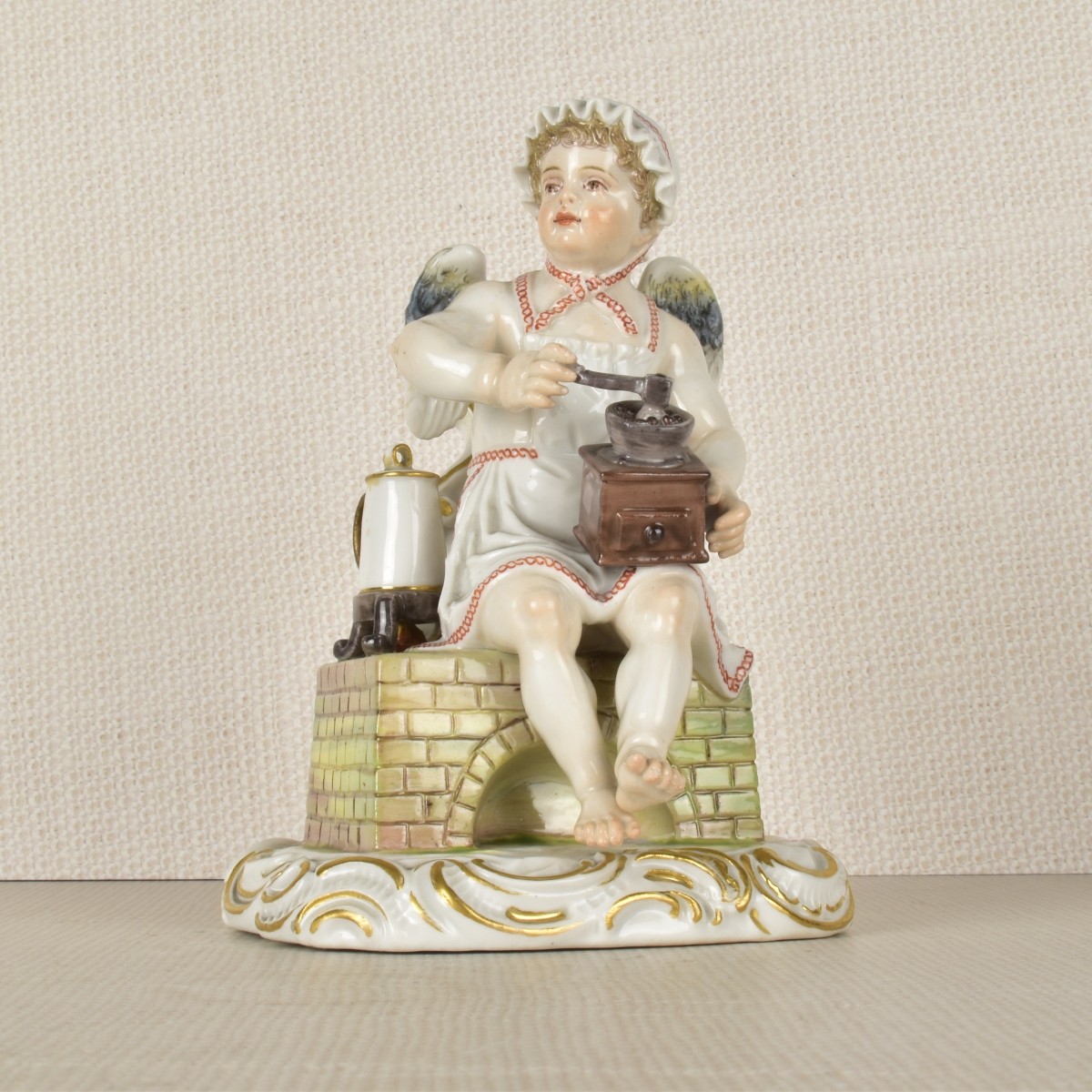 Meissen Figurine of a Young Boy Grinding Coffee