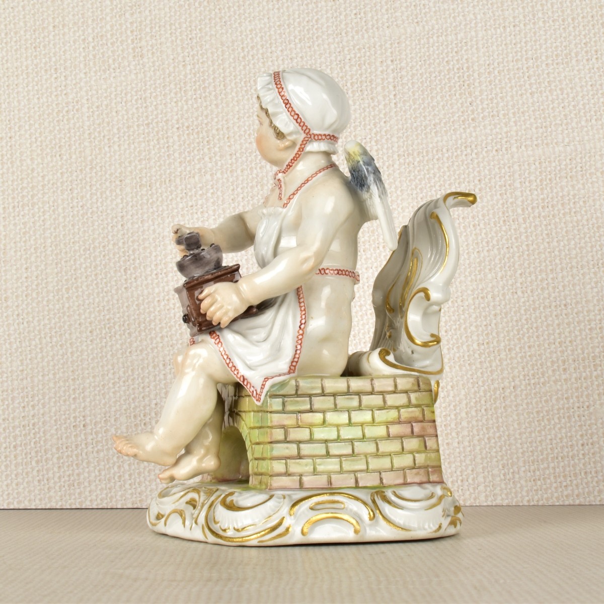 Meissen Figurine of a Young Boy Grinding Coffee