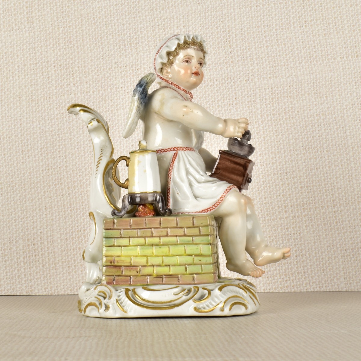 Meissen Figurine of a Young Boy Grinding Coffee