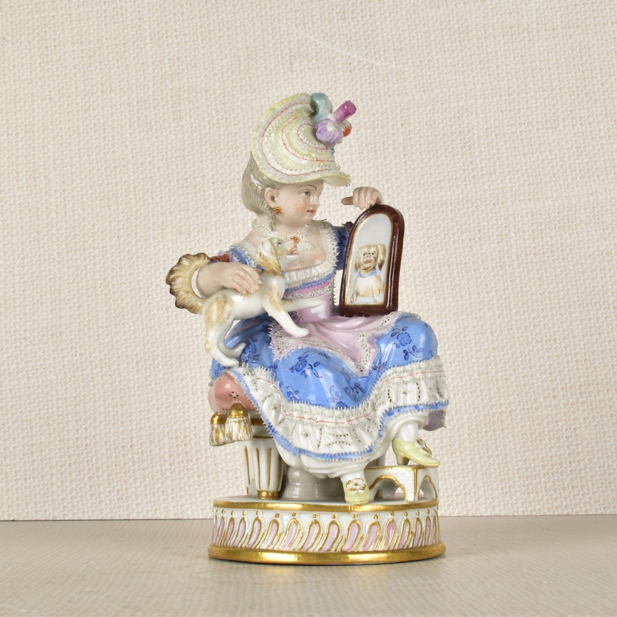 Meissen Figurine of a Lady Sitting with a Dog