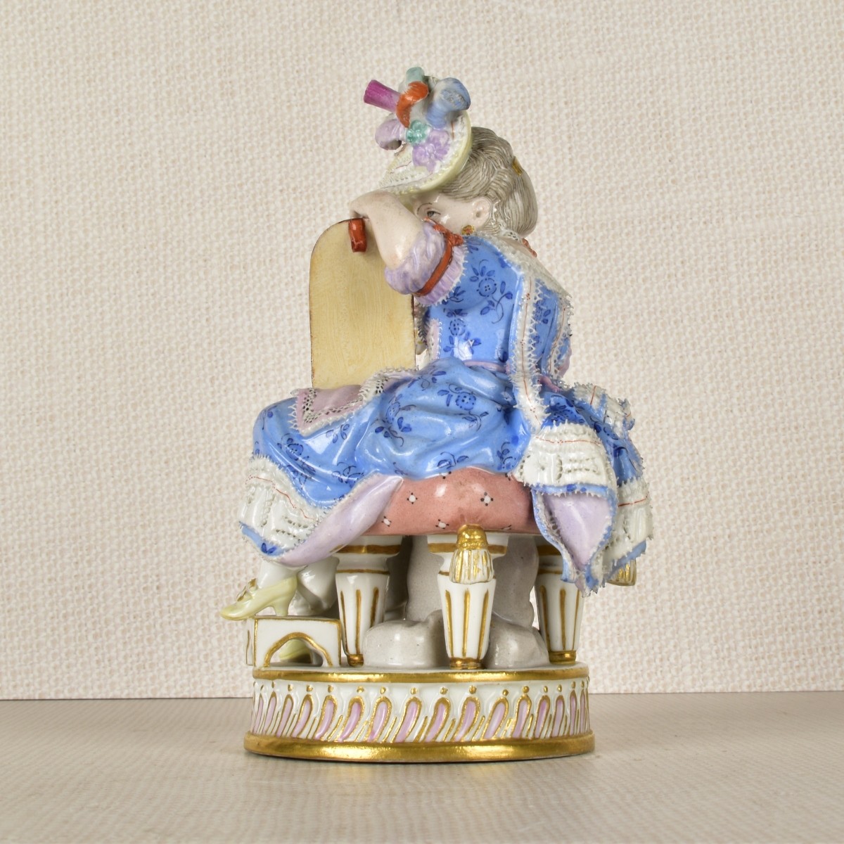 Meissen Figurine of a Lady Sitting with a Dog