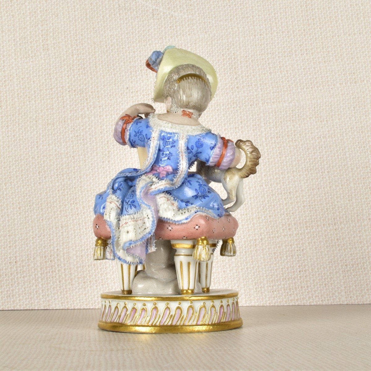 Meissen Figurine of a Lady Sitting with a Dog