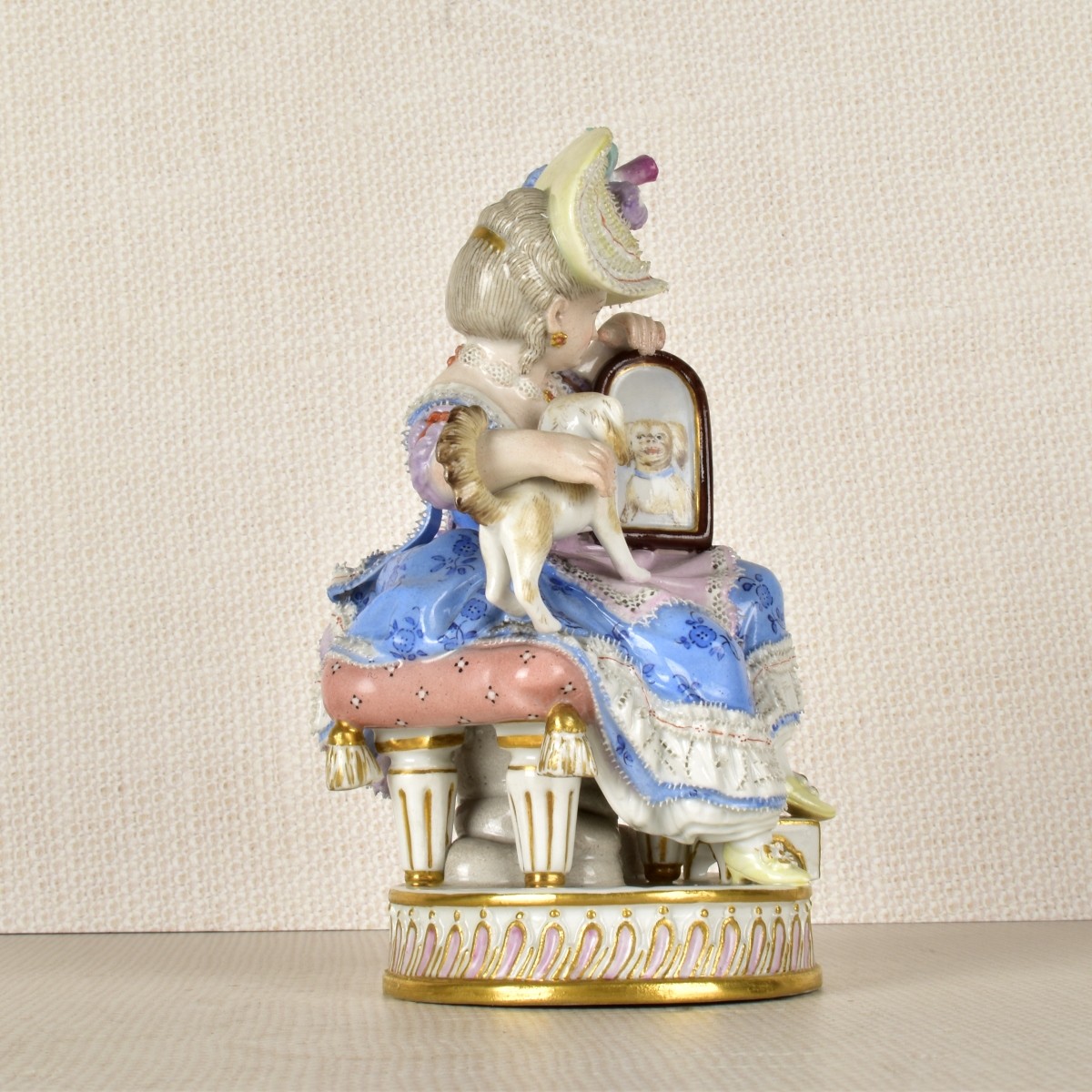 Meissen Figurine of a Lady Sitting with a Dog