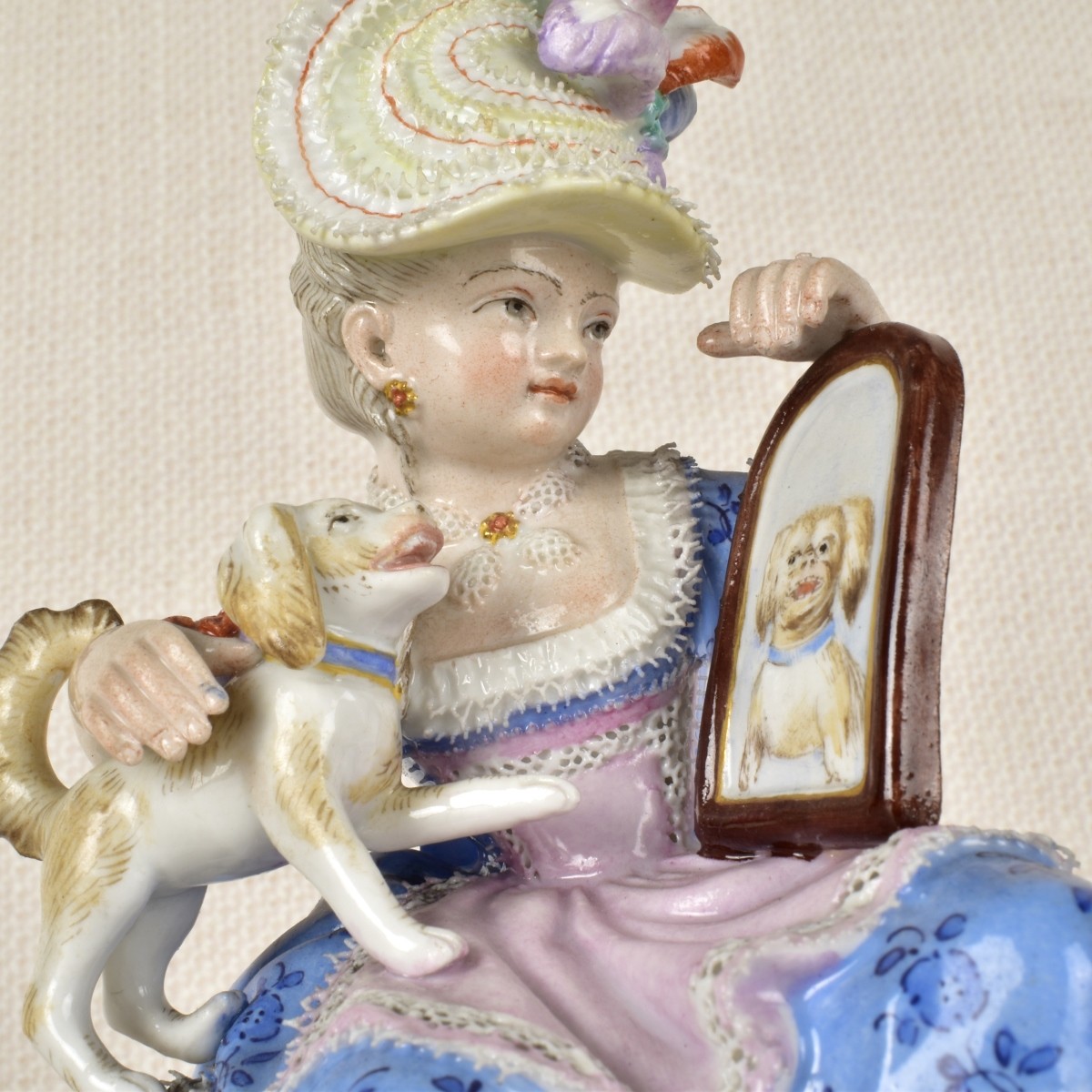 Meissen Figurine of a Lady Sitting with a Dog