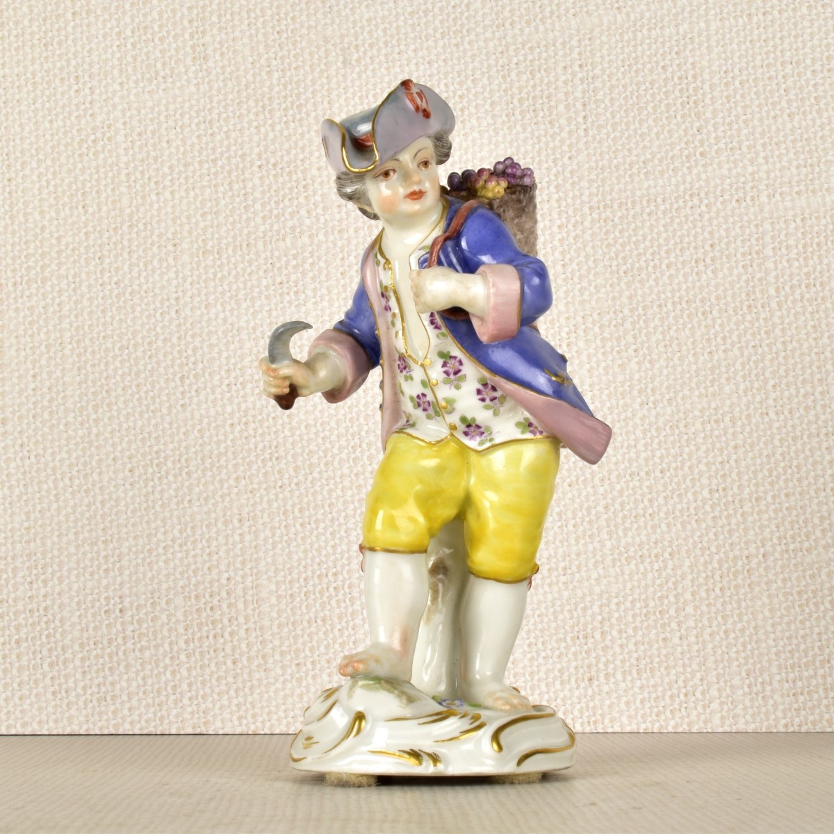 Meissen Porcelain Figurine of a Boy with Flowers