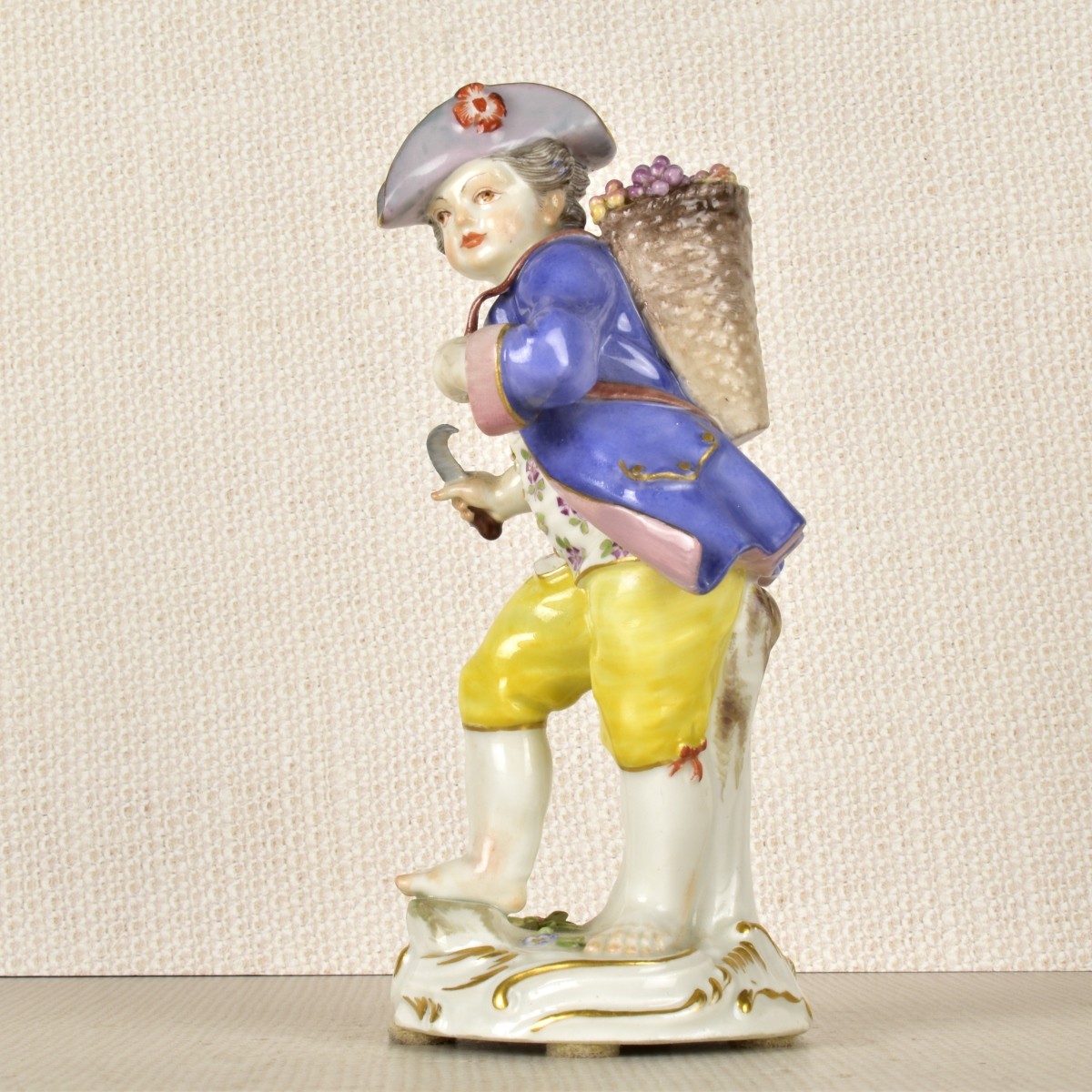 Meissen Porcelain Figurine of a Boy with Flowers