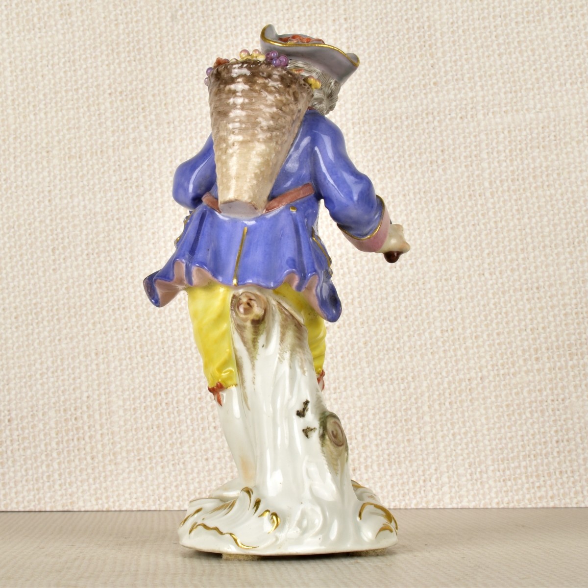 Meissen Porcelain Figurine of a Boy with Flowers