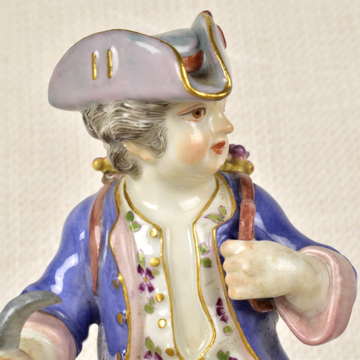 Meissen Porcelain Figurine of a Boy with Flowers