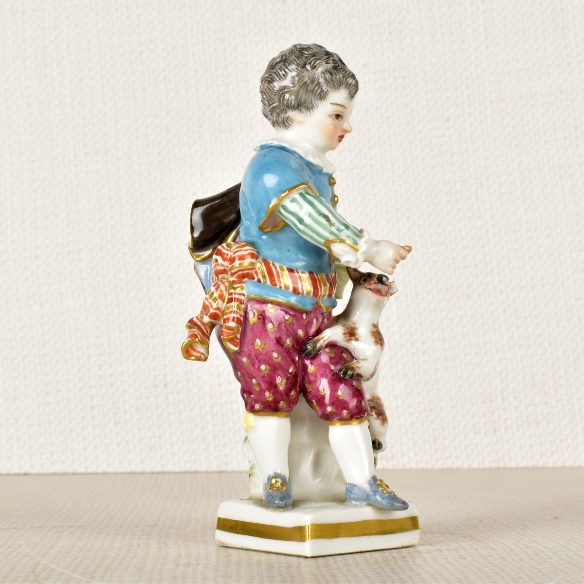 Meissen Porcelain Figurine of a Young Boy and Dog