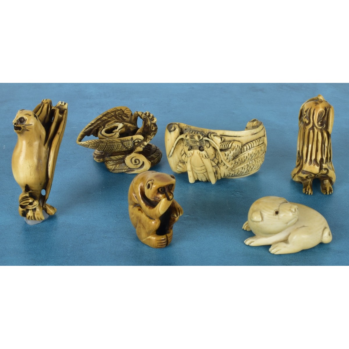 Six Japanese Polychromed Carved Netsuke's