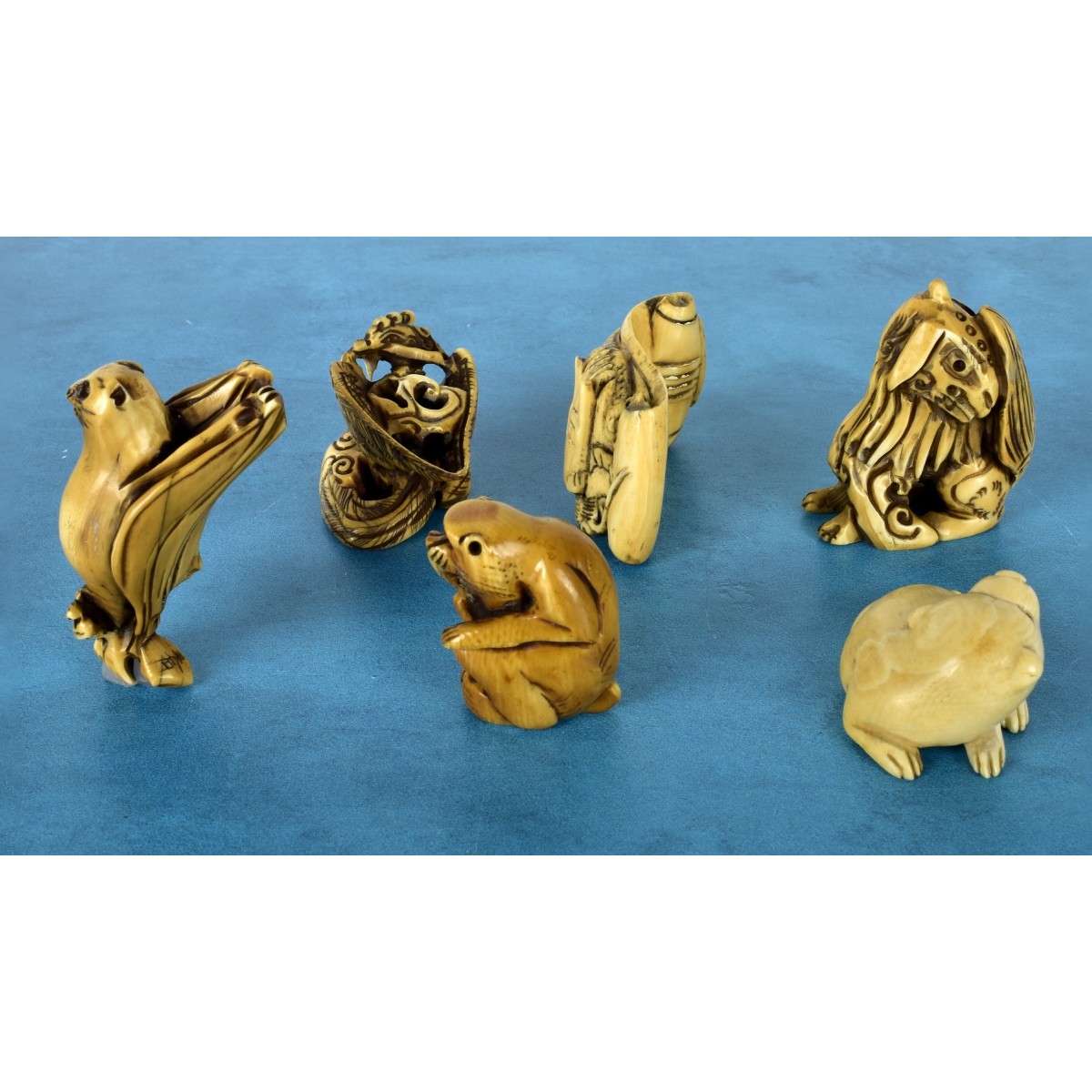 Six Japanese Polychromed Carved Netsuke's