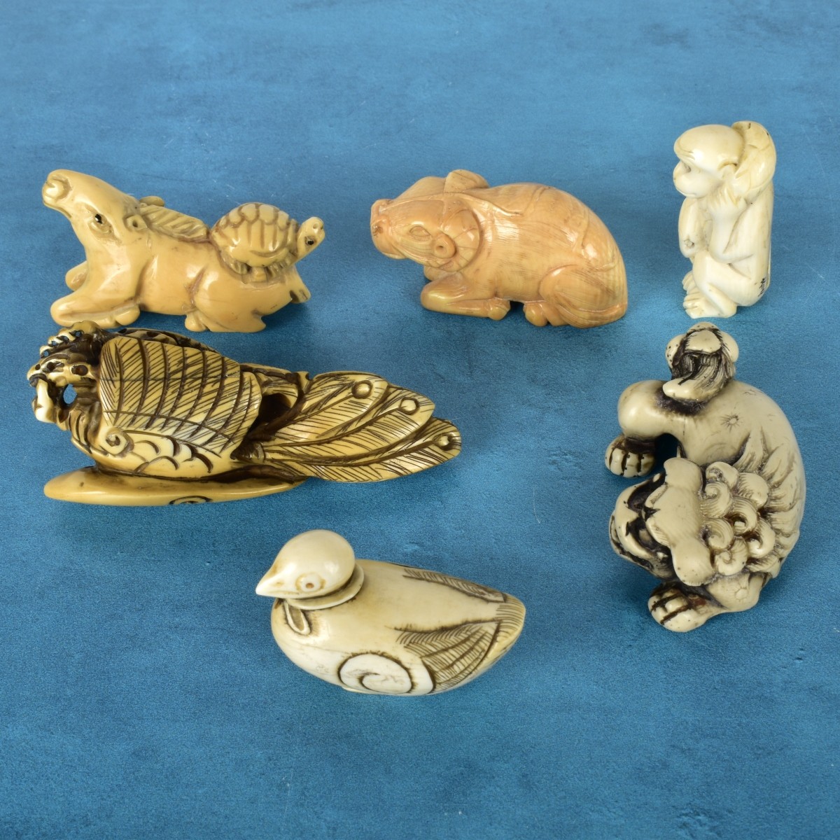 Six Japanese Polychromed Carved Netsuke's