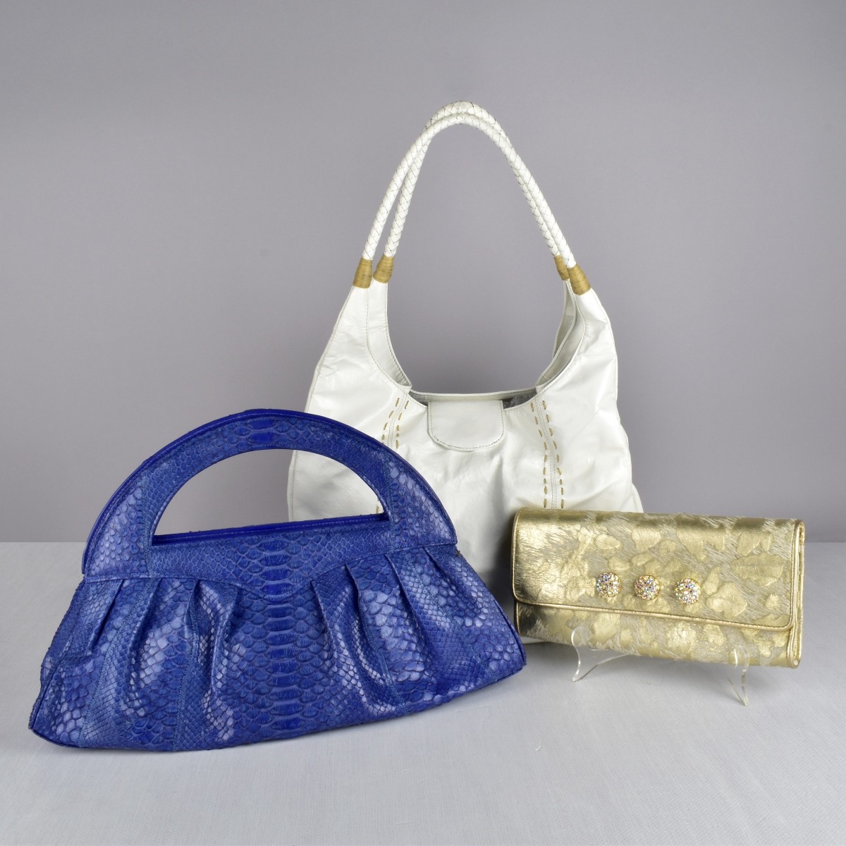 Three Carlos Falchi Designer Handbags