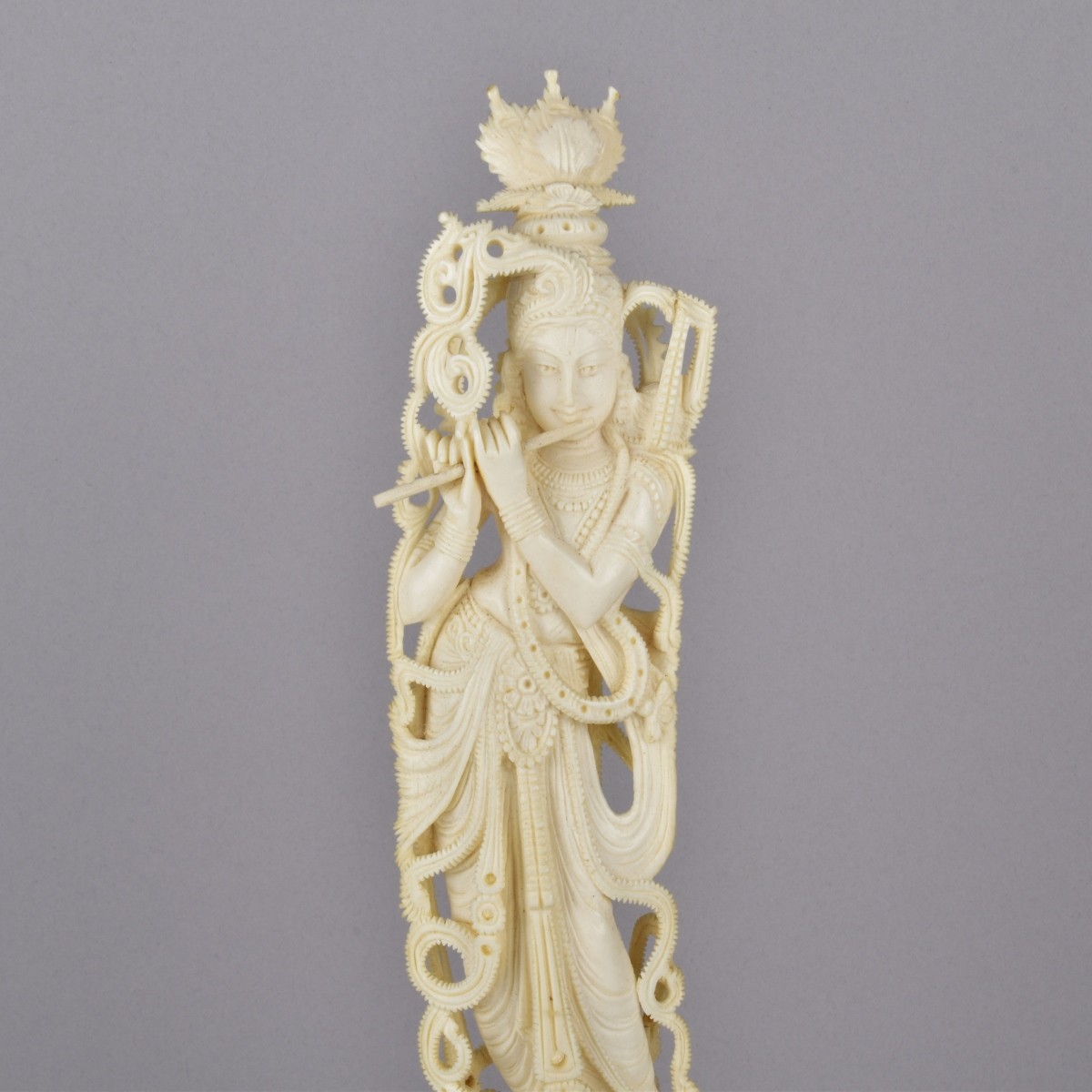 Antique Carving of a Krishna Playing a Flute