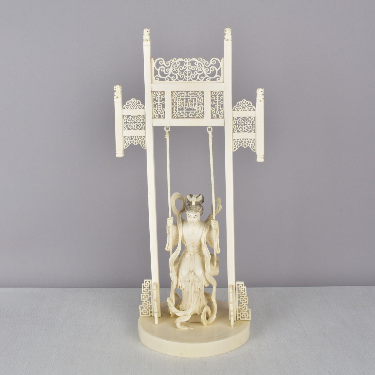 Chinese Carved Figure of Mother in Swing