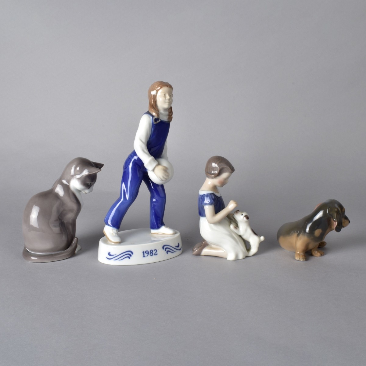 Four Porcelain Figurines