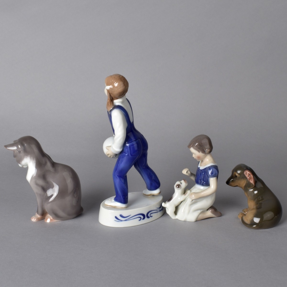 Four Porcelain Figurines