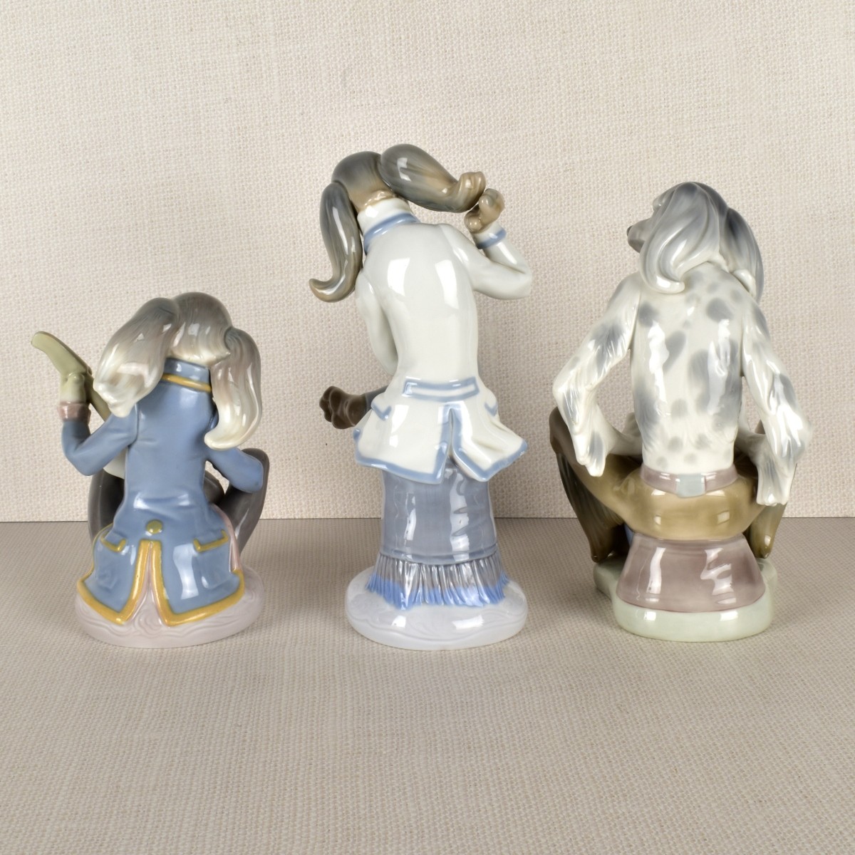 Three Lladro Porcelain Dog Band Figurines