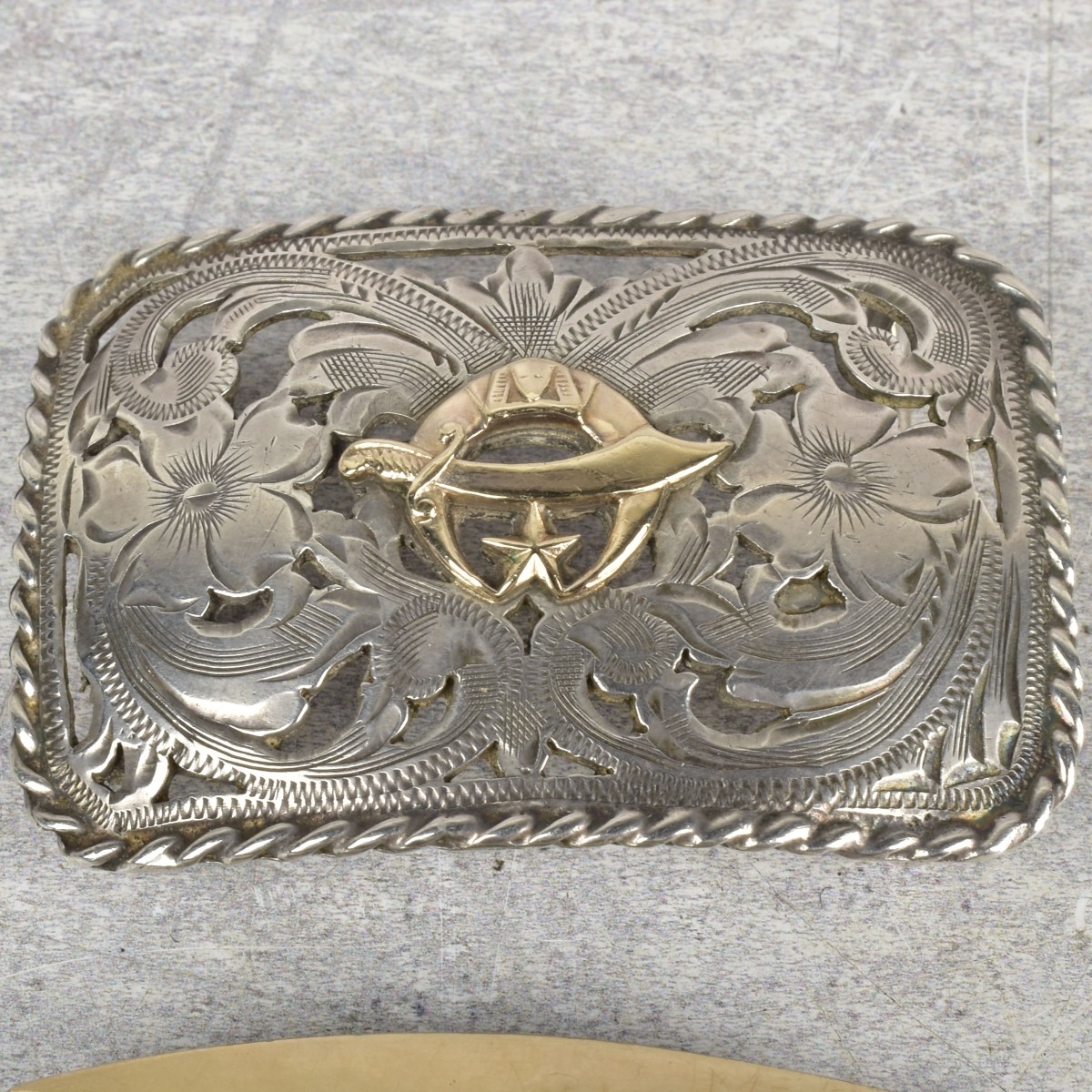 Sterling Silver and Gold Belt Buckles