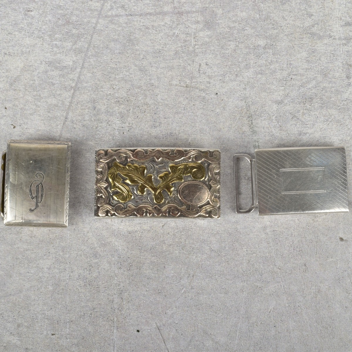 Sterling Silver and Gold Belt Buckles