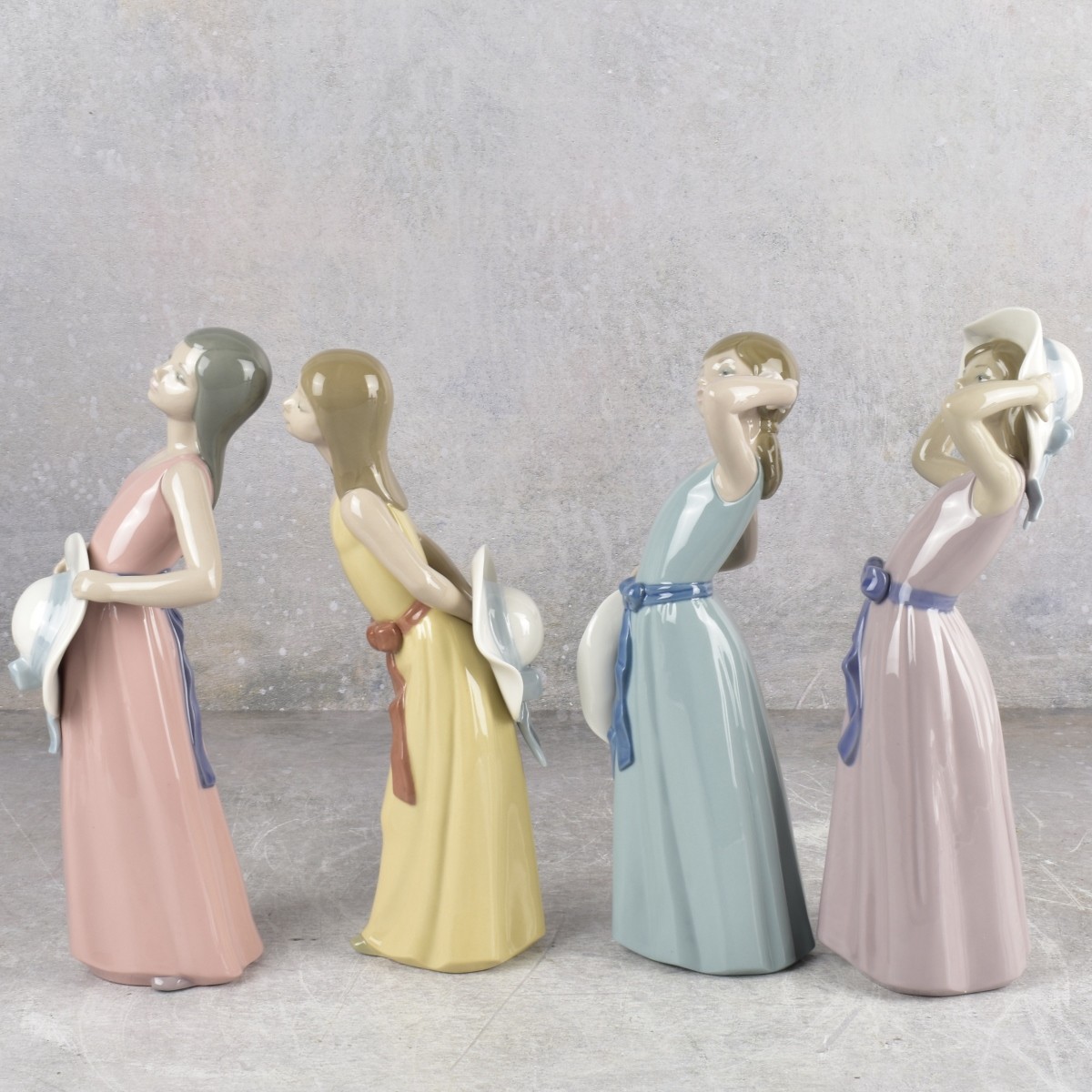 Lladro "Girl with Hat" Sculptures