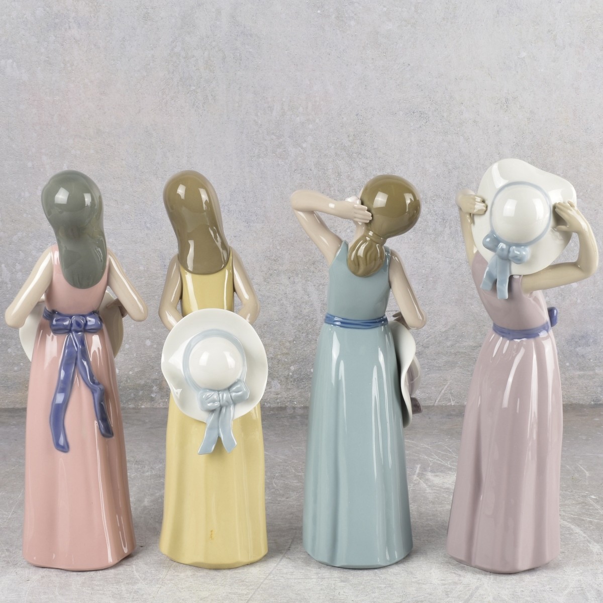 Lladro "Girl with Hat" Sculptures