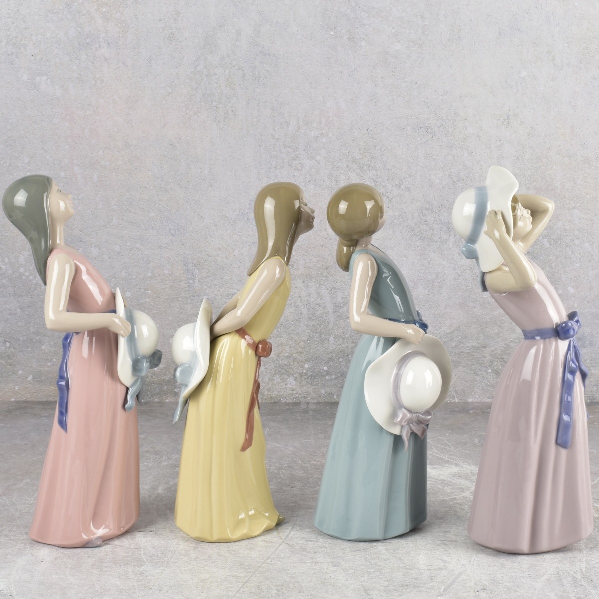 Lladro "Girl with Hat" Sculptures