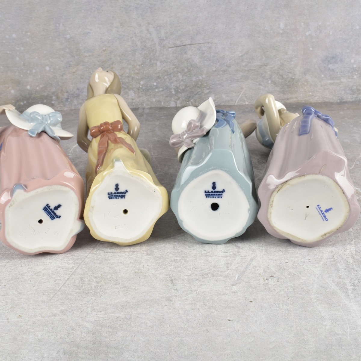 Lladro "Girl with Hat" Sculptures