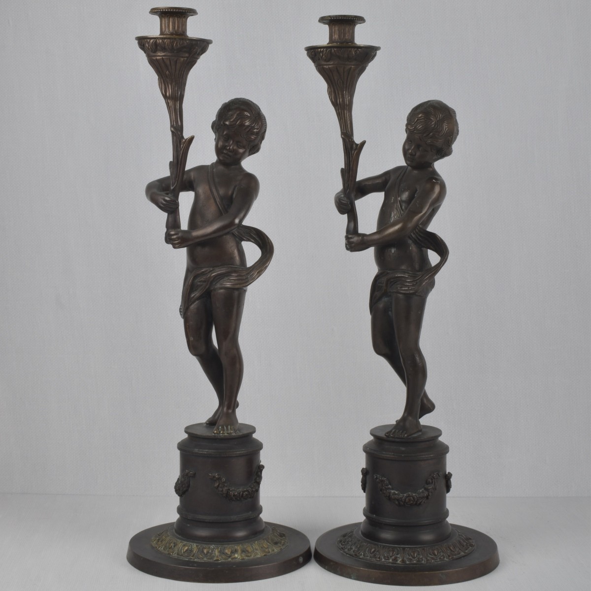 Pair of Bronze Figural Candlesticks