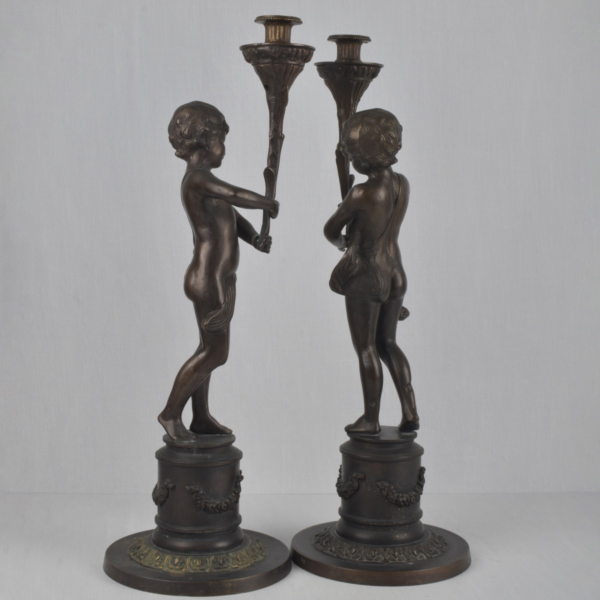 Pair of Bronze Figural Candlesticks