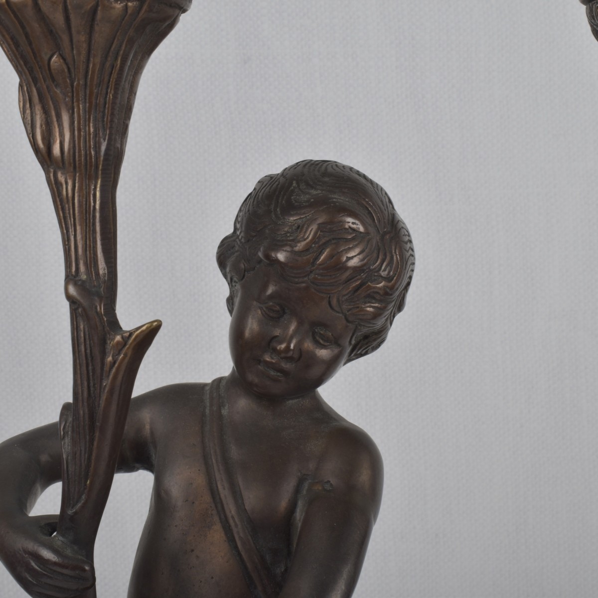 Pair of Bronze Figural Candlesticks