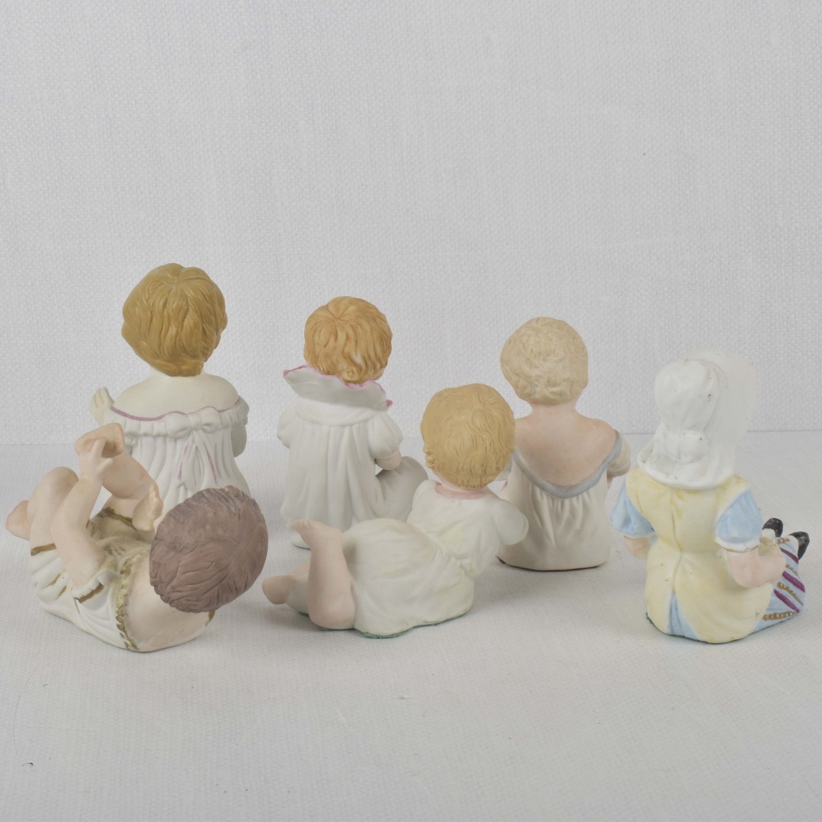 Porcelain Bisque Piano Babies