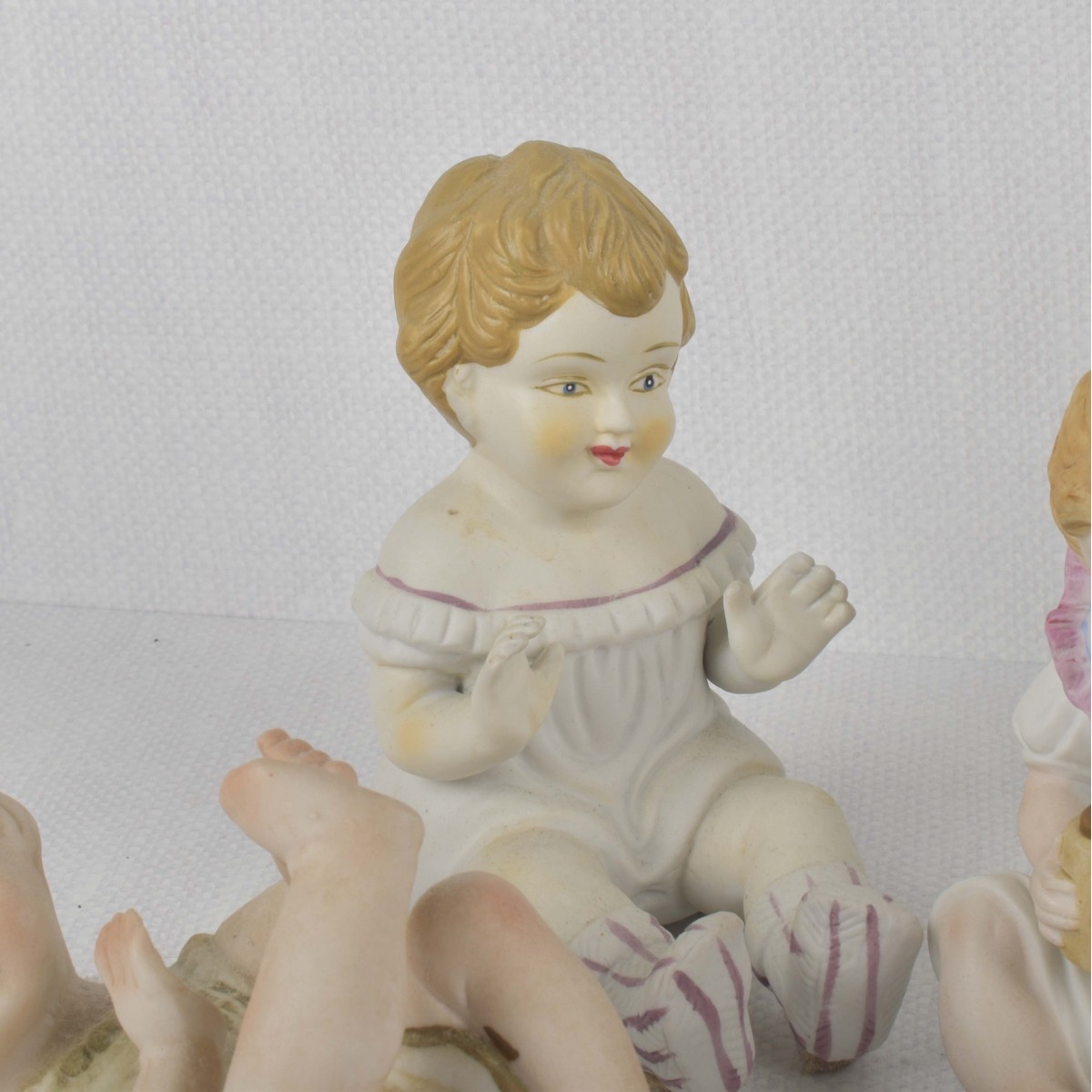Porcelain Bisque Piano Babies