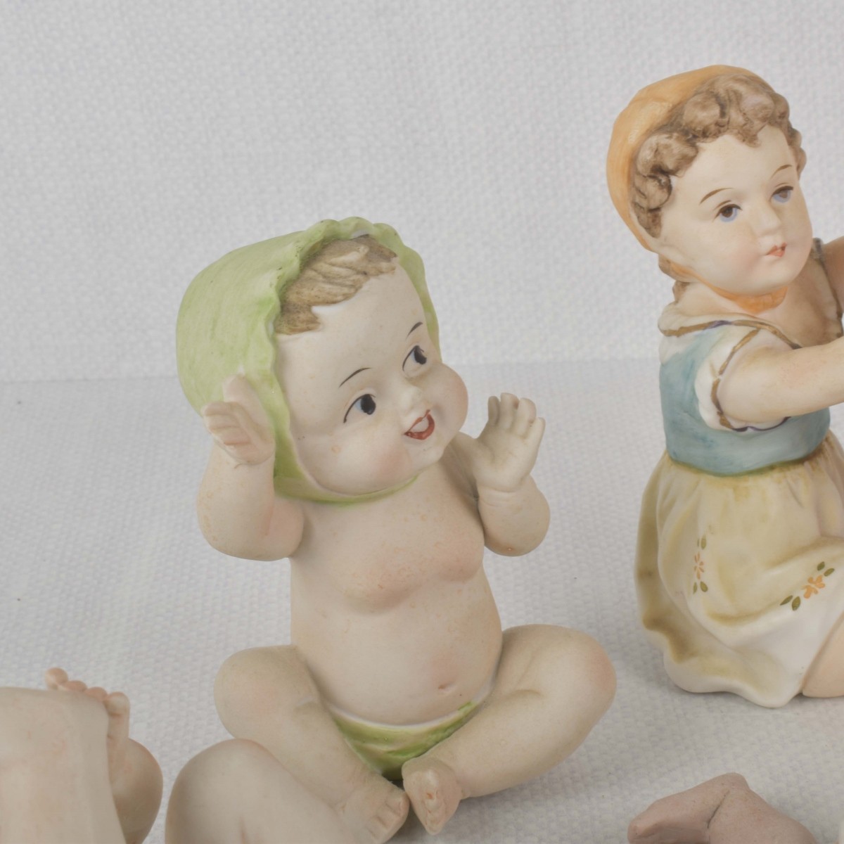 Porcelain Bisque Piano Babies
