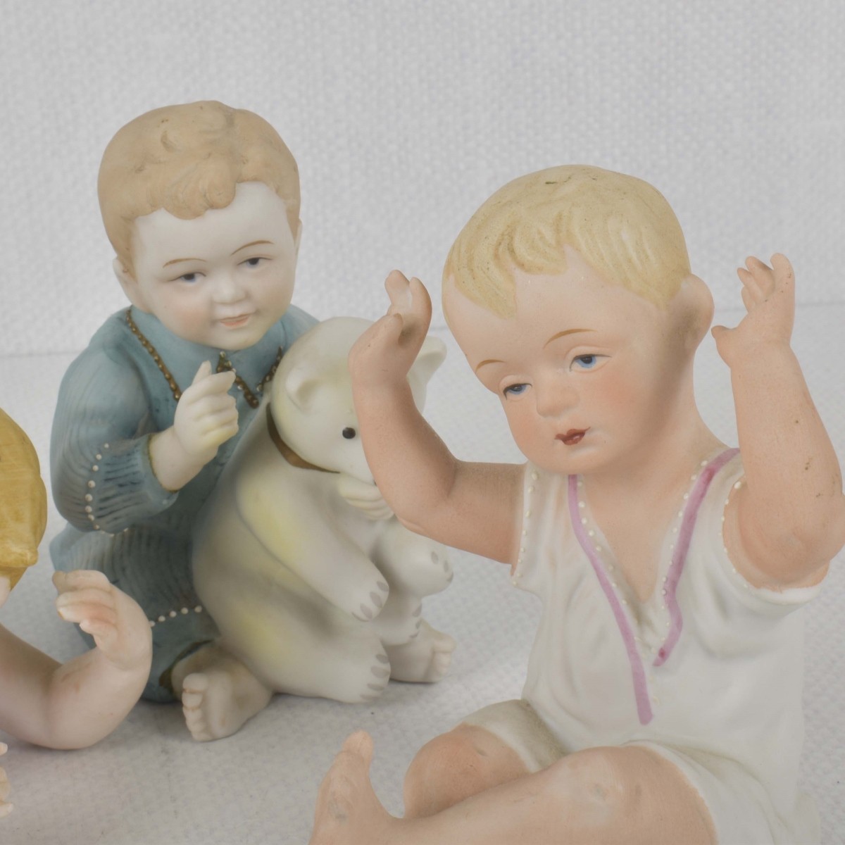 Porcelain Bisque Piano Babies