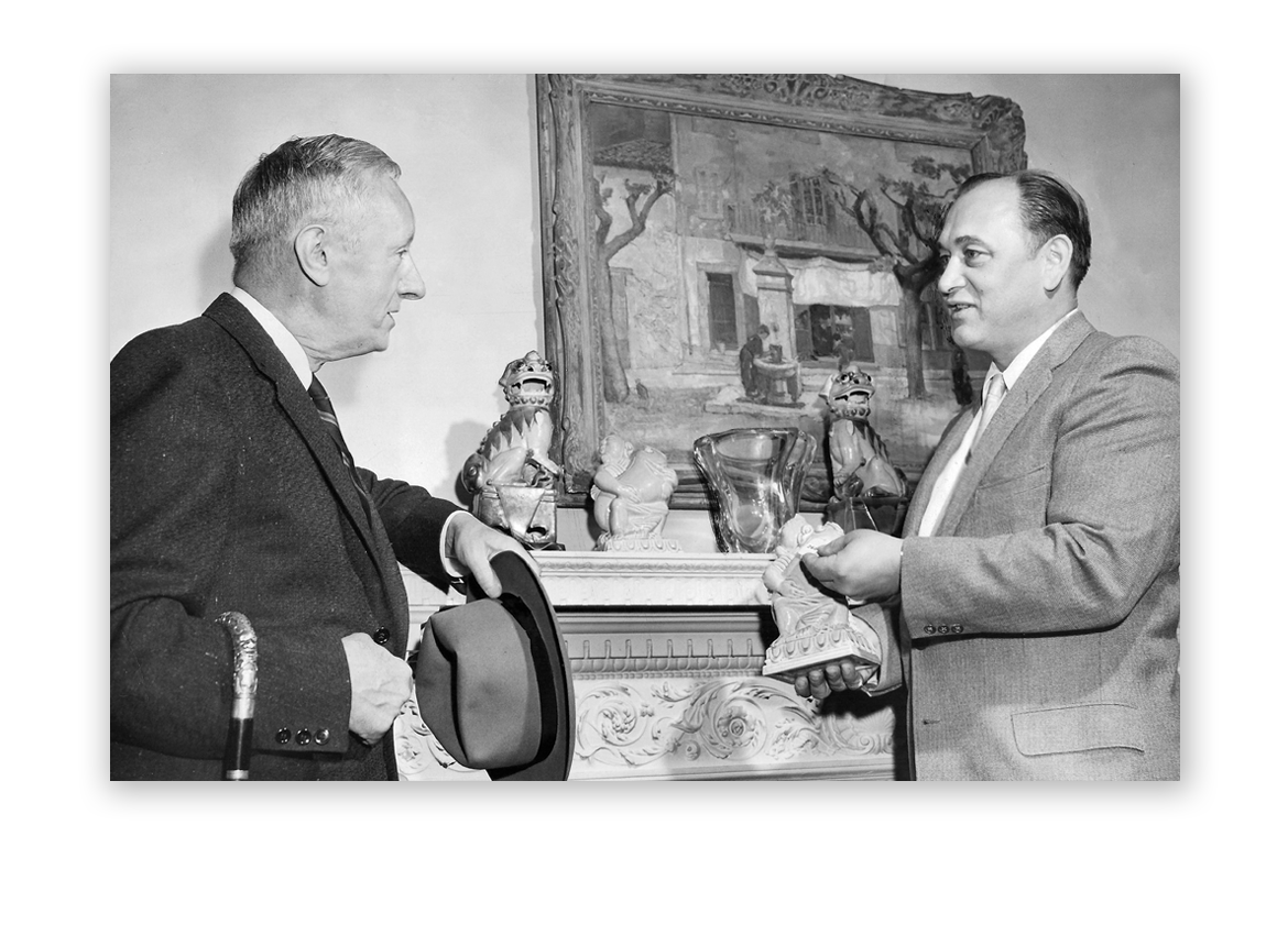 1958: Al Kodner speaking with art collector George T. Foster.
